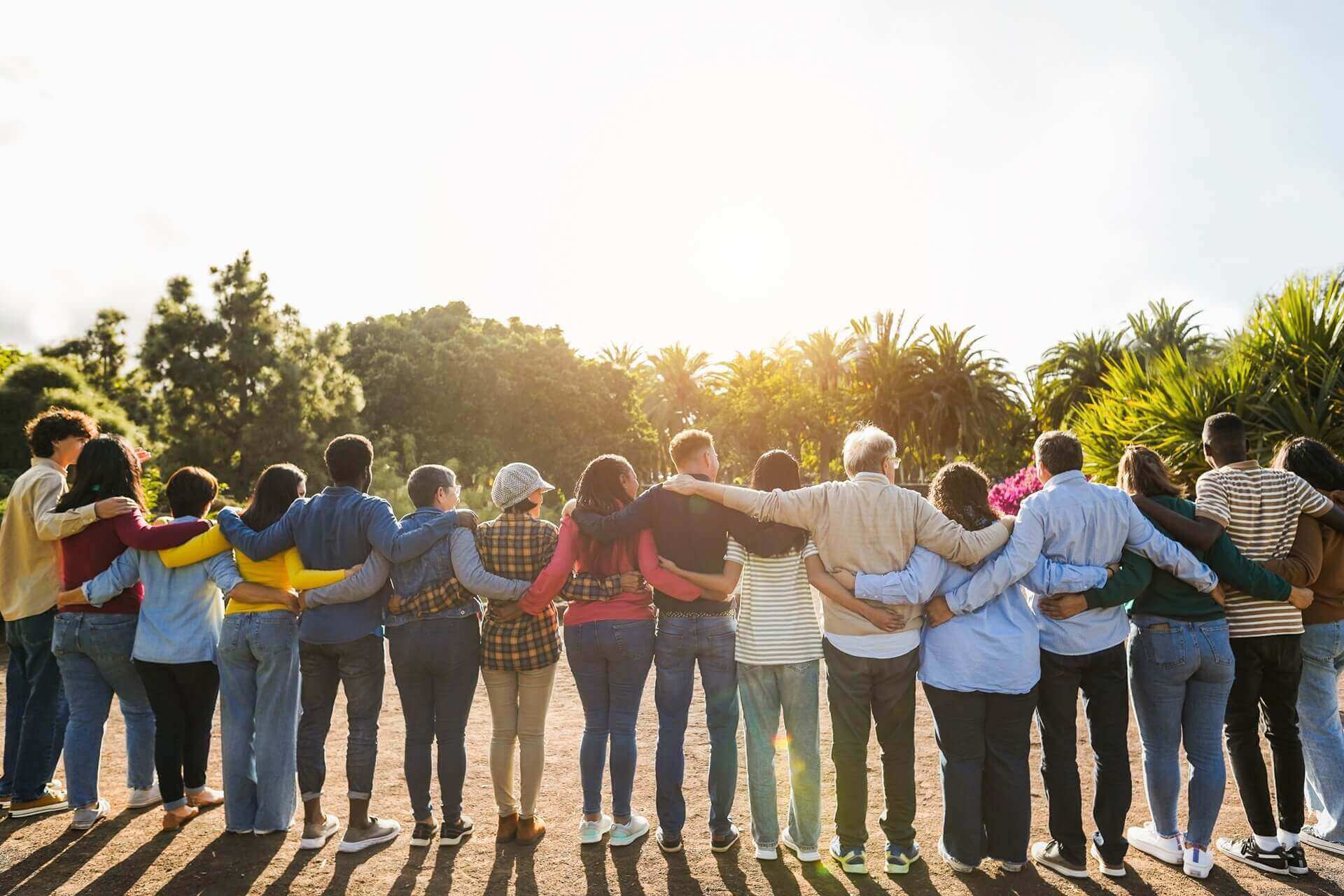 Group of multigenerational people hugging each others