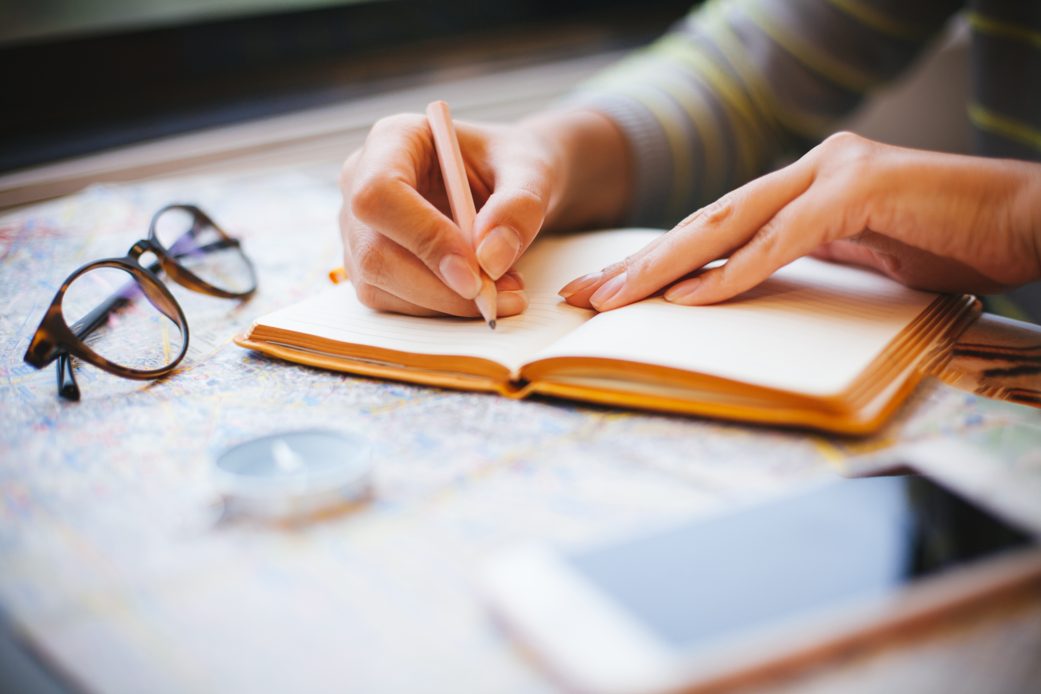 Young woman planning a trip, travelling by train