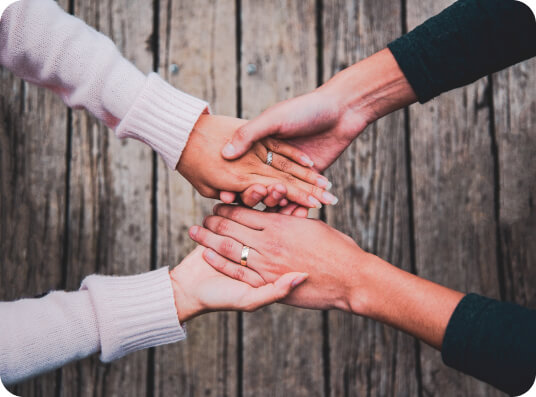 Two people holding hands