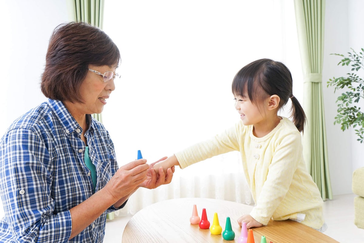 Grandma and granddaughter are playing together