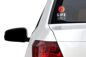 The rear of the car with a Life 100.7 sticker