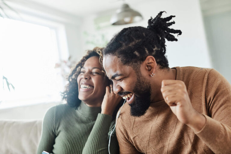 A couple dancing while listening to new music